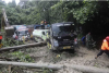 9 die as rain-triggered landslide hits tourist bus in Indonesia’s Sumatra island