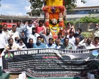 ournalists under the banner of TUWJ - IJU demonstrated near Mahatma Gandhi statue, MG Road, Secunderabad 