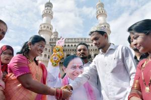 TRS Mahila leaders tying rakhi to portrait of CM KCR 